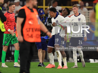 Ollie Watkins (England) is being congratulated by Kobbie Mainoo (England) after the Semi Final of the UEFA European Championship between Eng...