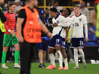 Ollie Watkins (England) is being congratulated by Kobbie Mainoo (England) after the Semi Final of the UEFA European Championship between Eng...