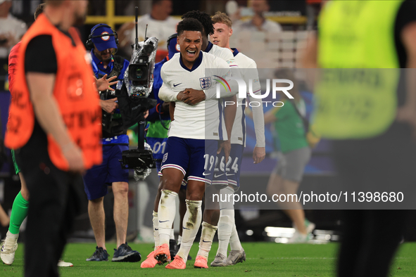 Ollie Watkins (England) is being congratulated by Kobbie Mainoo (England) after the Semi Final of the UEFA European Championship between Eng...