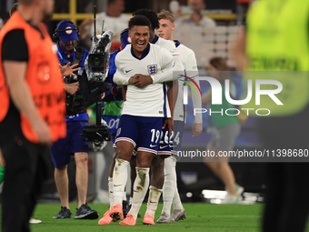 Ollie Watkins (England) is being congratulated by Kobbie Mainoo (England) after the Semi Final of the UEFA European Championship between Eng...