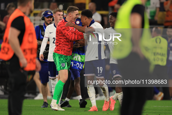 Ollie Watkins (England) is being congratulated by Dean Henderson (England) after the Semi Final of the UEFA European Championship between En...