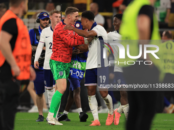 Ollie Watkins (England) is being congratulated by Dean Henderson (England) after the Semi Final of the UEFA European Championship between En...