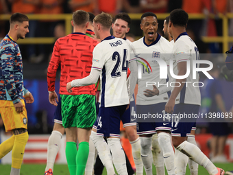 Ollie Watkins (England) is being congratulated by Aston Villa teammate Ezri Konsa (England) after the Semi Final of the UEFA European Champi...