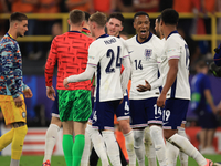 Ollie Watkins (England) is being congratulated by Aston Villa teammate Ezri Konsa (England) after the Semi Final of the UEFA European Champi...