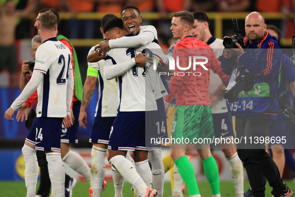 Ollie Watkins (England) is being congratulated by Aston Villa teammate Ezri Konsa (England) after the Semi Final of the UEFA European Champi...