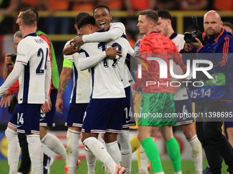 Ollie Watkins (England) is being congratulated by Aston Villa teammate Ezri Konsa (England) after the Semi Final of the UEFA European Champi...