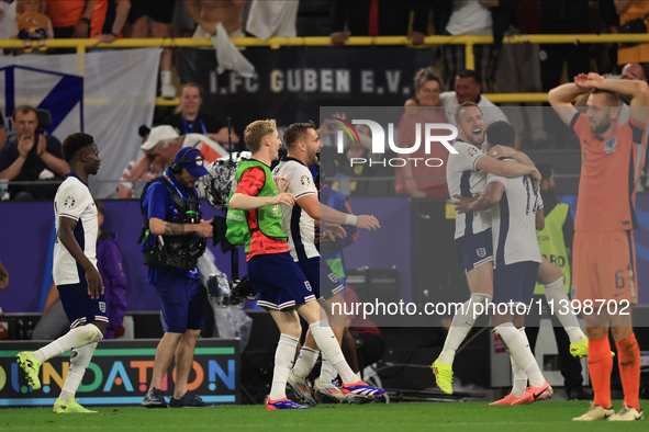 Harry Kane (England) is reacting to the final whistle and celebrating with Ollie Watkins (England) after the Semi Final of the UEFA European...