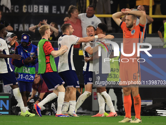 Harry Kane (England) is reacting to the final whistle and celebrating with Ollie Watkins (England) after the Semi Final of the UEFA European...