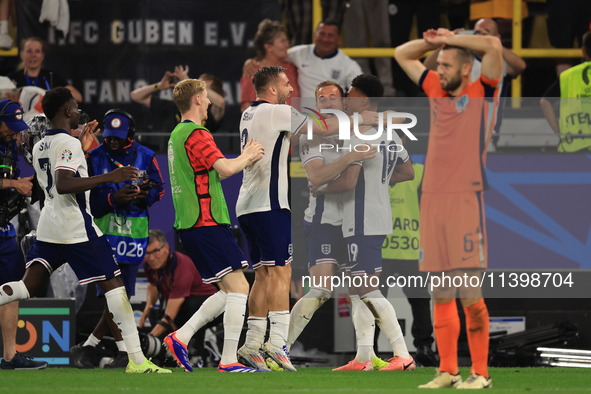 Harry Kane (England) is reacting to the final whistle and celebrating with Ollie Watkins (England) after the Semi Final of the UEFA European...