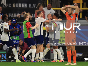 Harry Kane (England) is reacting to the final whistle and celebrating with Ollie Watkins (England) after the Semi Final of the UEFA European...