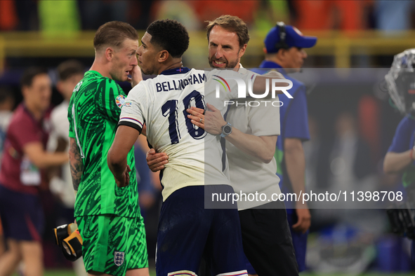 Gareth Southgate, England manager, is with Jude Bellingham (England) after the Semi Final of the UEFA European Championship between England...