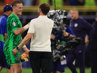 Gareth Southgate, England manager, is with Jordan Pickford (England) after the Semi Final of the UEFA European Championship between England...