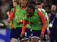 Eberechi Eze (England) is laughing with Trent Alexander-Arnold (England) after the Semi Final of the UEFA European Championship between Engl...