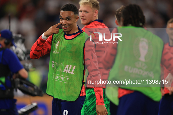 Eberechi Eze (England) is laughing with Trent Alexander-Arnold (England) after the Semi Final of the UEFA European Championship between Engl...