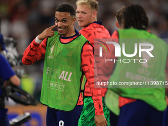 Eberechi Eze (England) is laughing with Trent Alexander-Arnold (England) after the Semi Final of the UEFA European Championship between Engl...