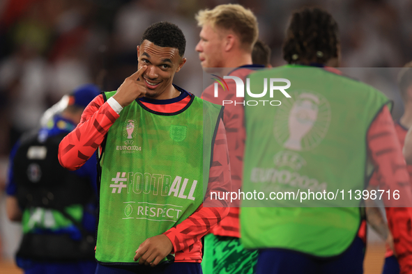 Eberechi Eze (England) is laughing with Trent Alexander-Arnold (England) after the Semi Final of the UEFA European Championship between Engl...