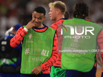 Eberechi Eze (England) is laughing with Trent Alexander-Arnold (England) after the Semi Final of the UEFA European Championship between Engl...