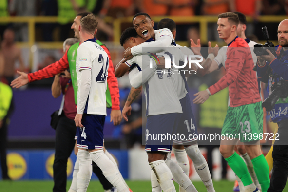 Ollie Watkins (England) is being congratulated by Aston Villa teammate Ezri Konsa (England) after the Semi Final of the UEFA European Champi...