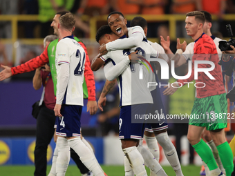 Ollie Watkins (England) is being congratulated by Aston Villa teammate Ezri Konsa (England) after the Semi Final of the UEFA European Champi...