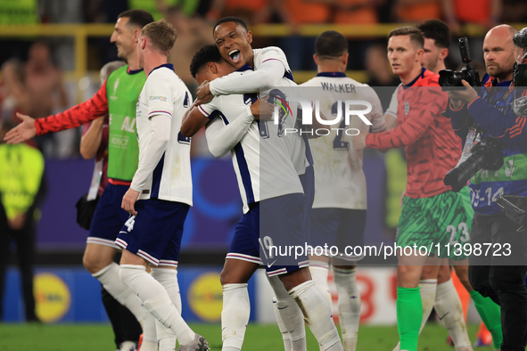 Ollie Watkins (England) is being congratulated by Aston Villa teammate Ezri Konsa (England) after the Semi Final of the UEFA European Champi...