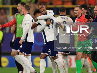 Ollie Watkins (England) is being congratulated by Aston Villa teammate Ezri Konsa (England) after the Semi Final of the UEFA European Champi...