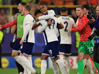 Ollie Watkins (England) is being congratulated by Aston Villa teammate Ezri Konsa (England) after the Semi Final of the UEFA European Champi...