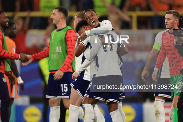 Ollie Watkins (England) is being congratulated by Aston Villa teammate Ezri Konsa (England) after the Semi Final of the UEFA European Champi...