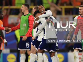 Ollie Watkins (England) is being congratulated by Aston Villa teammate Ezri Konsa (England) after the Semi Final of the UEFA European Champi...