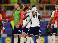 Ollie Watkins (England) is being congratulated by Aston Villa teammate Ezri Konsa (England) after the Semi Final of the UEFA European Champi...