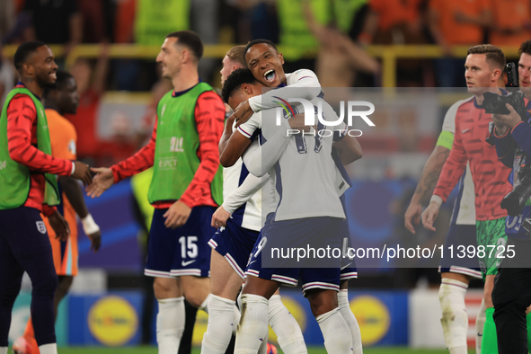 Ollie Watkins (England) is being congratulated by Aston Villa teammate Ezri Konsa (England) after the Semi Final of the UEFA European Champi...