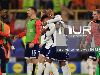 Ollie Watkins (England) is being congratulated by Aston Villa teammate Ezri Konsa (England) after the Semi Final of the UEFA European Champi...