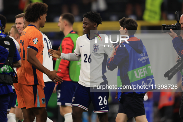 Kobbie Mainoo (England) is commiserating with Joshua Zirkzee (Netherlands) after the Semi Final of the UEFA European Championship between En...