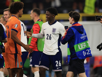 Kobbie Mainoo (England) is commiserating with Joshua Zirkzee (Netherlands) after the Semi Final of the UEFA European Championship between En...