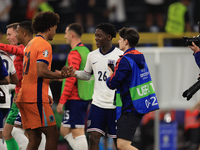 Kobbie Mainoo (England) is commiserating with Joshua Zirkzee (Netherlands) after the Semi Final of the UEFA European Championship between En...