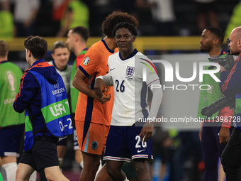 Kobbie Mainoo (England) is commiserating with Joshua Zirkzee (Netherlands) after the Semi Final of the UEFA European Championship between En...