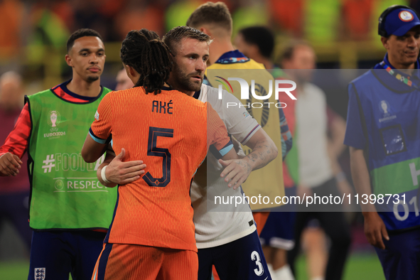 Luke Shaw (England) is commiserating with Nathan Ake (Netherlands) after the Semi Final of the UEFA European Championship between England an...