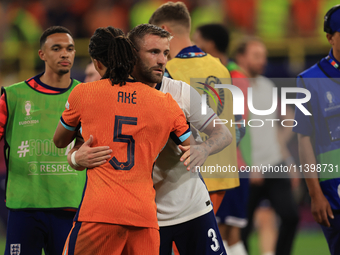 Luke Shaw (England) is commiserating with Nathan Ake (Netherlands) after the Semi Final of the UEFA European Championship between England an...