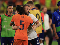 Luke Shaw (England) is commiserating with Nathan Ake (Netherlands) after the Semi Final of the UEFA European Championship between England an...