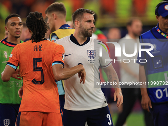 Luke Shaw (England) is commiserating with Nathan Ake (Netherlands) after the Semi Final of the UEFA European Championship between England an...