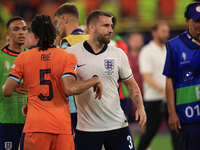 Luke Shaw (England) is commiserating with Nathan Ake (Netherlands) after the Semi Final of the UEFA European Championship between England an...