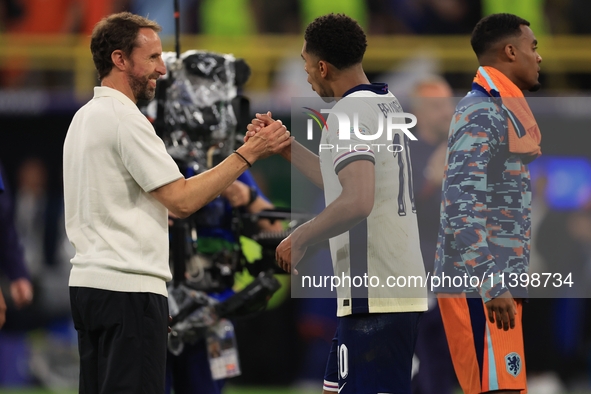 Gareth Southgate, England manager, is with Jude Bellingham (England) after the Semi Final of the UEFA European Championship between England...