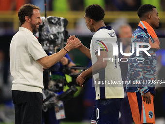 Gareth Southgate, England manager, is with Jude Bellingham (England) after the Semi Final of the UEFA European Championship between England...