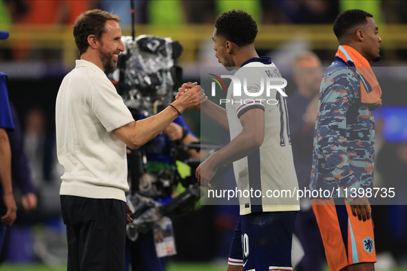 Gareth Southgate, England manager, is with Jude Bellingham (England) after the Semi Final of the UEFA European Championship between England...