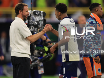 Gareth Southgate, England manager, is with Jude Bellingham (England) after the Semi Final of the UEFA European Championship between England...