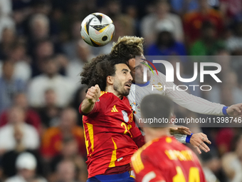 Marc Cucurella left-back of Spain and Chelsea FC and Antoine Griezmann centre-forward of France and Atletico de Madrid compete for the ball...