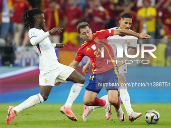 Mikel Oyarzabal centre-forward of Spain and Real Sociedad and William Saliba centre-back of France and Arsenal FC compete for the ball durin...