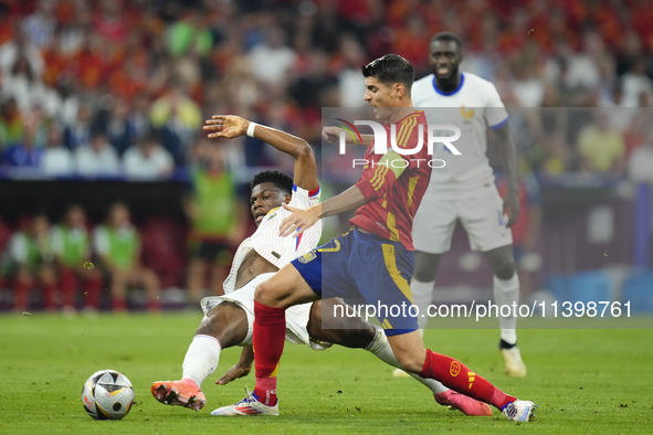 Alvaro Morata centre-forward of Spain and Atletico de Madrid and Aurelien Tchouameni defensive midfield of France and Real Madrid compete fo...