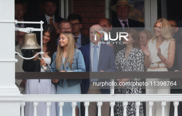 Lola and Ruby, along with their parents Michael and Catherine Anderson, and wife Daniella Anderson, are ringing the bell during the Rothesay...