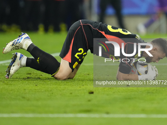 Unai Simon goalkeeper Athletic Club Bilbao makes a save during the UEFA EURO 2024 semi-final match between Spain v France at Munich Football...