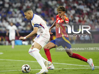 Kylian Mbappe centre-forward of France and Real Madrid and Lamine Yamal right winger of Spain and FC Barcelona during the UEFA EURO 2024 sem...